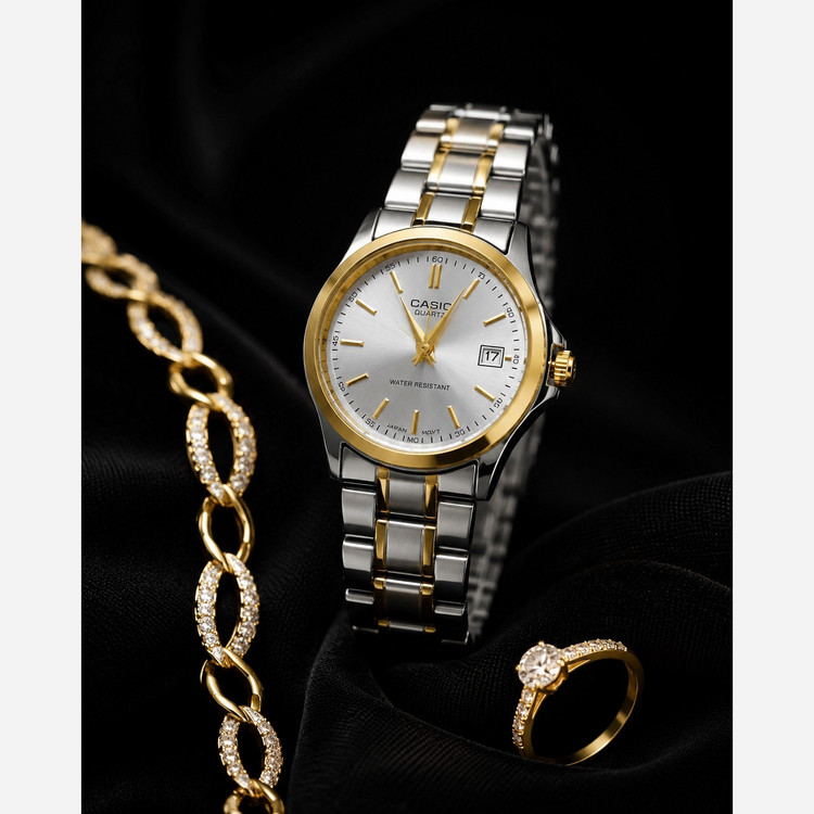 ساعت زنانه و دخترانه کاسیو casio بند استیل نقره ای طلایی تقویم دار