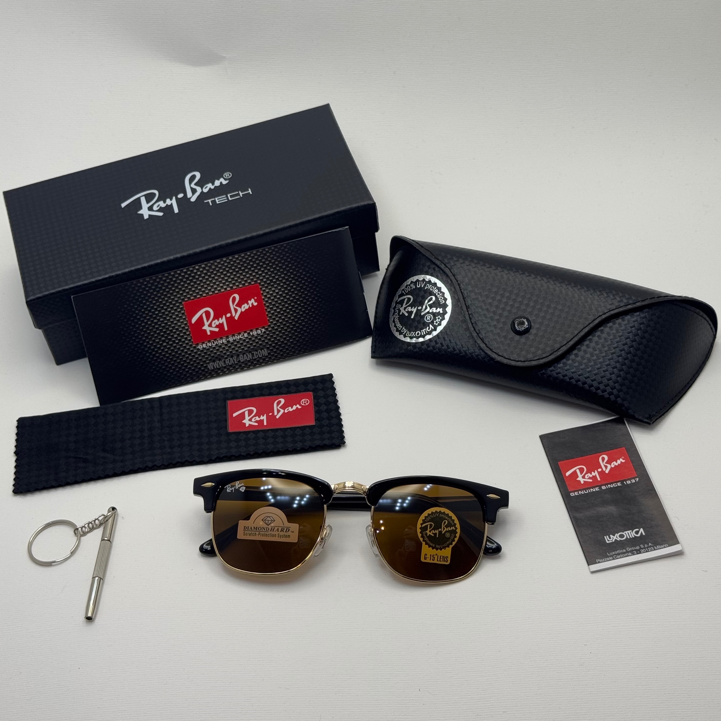 عینک آفتابی ریبن rayban کلاب مستر شیشه سنگ قهوه ای فریم طلایی rb 3016 به همراه پک کامل