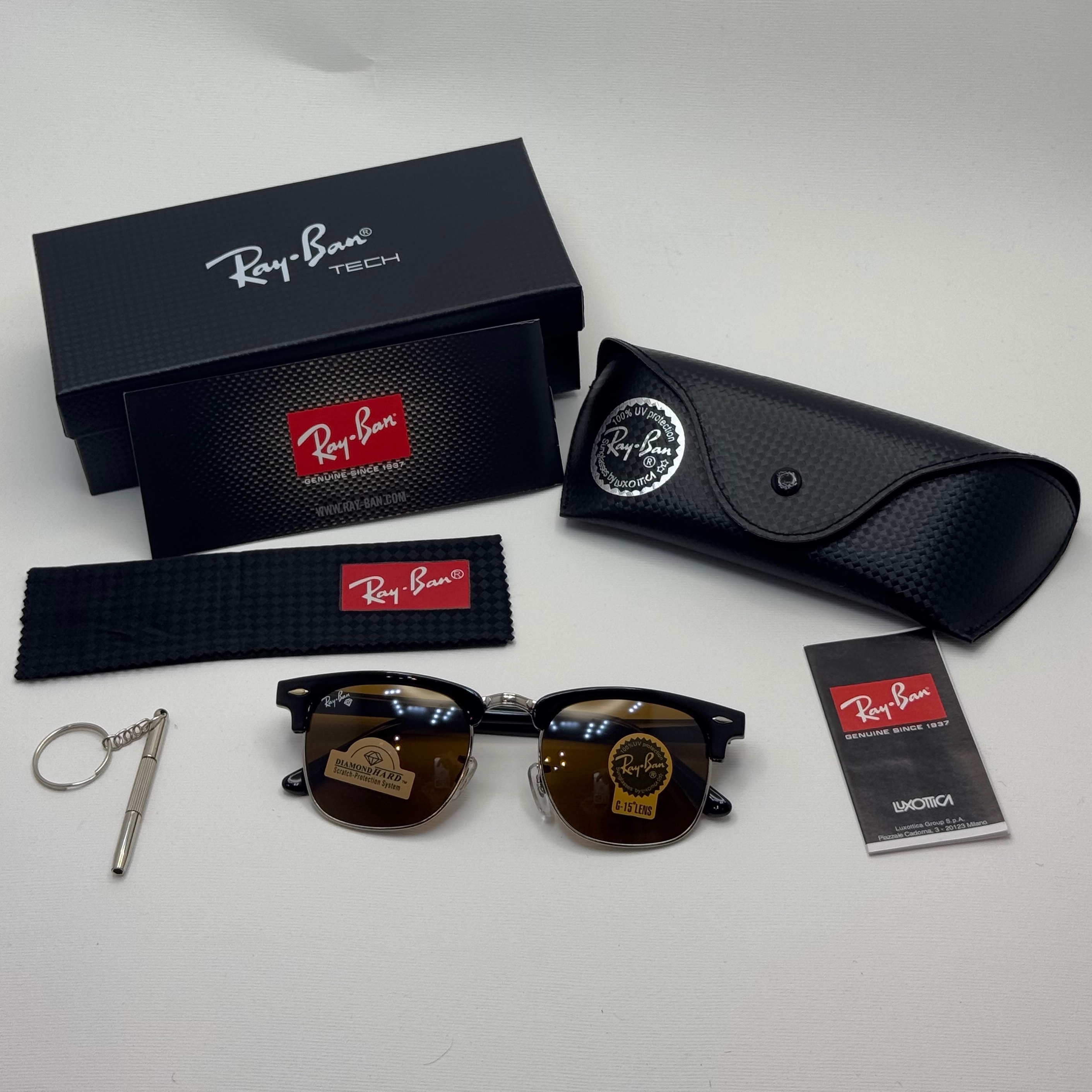 عینک آفتابی ریبن  rayban کلاب مستر شیشه سنگ قهوه ای فریم نقره ای rb 3016 به همراه پک کامل