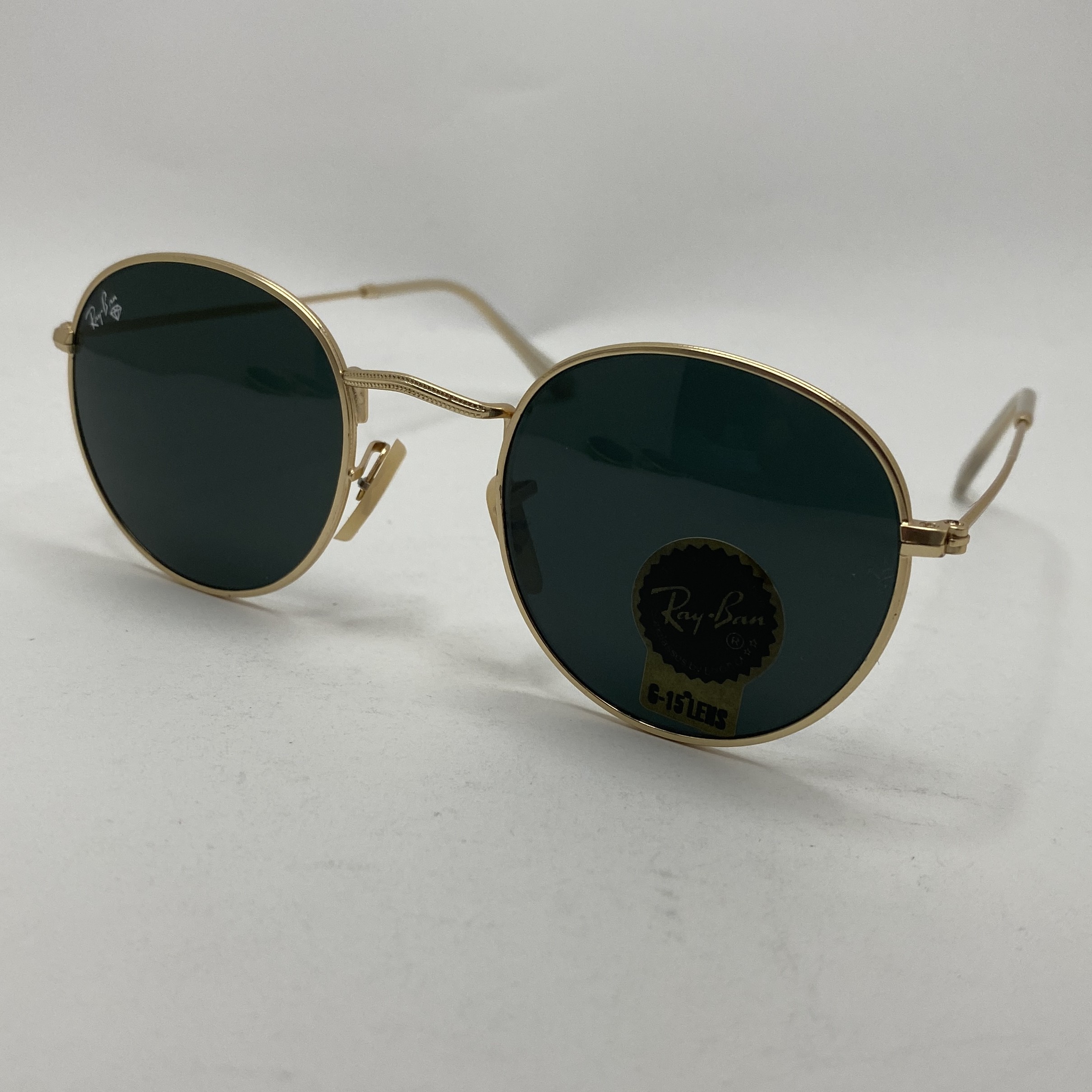 عینک آفتابی ریبن rayban گرد مشکی طلایی شیشه سنگ RB 3447