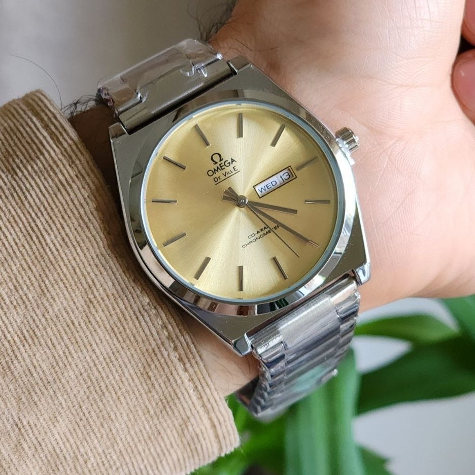 ساعت مچی مردانه امگا omega بند استیل نقره ای صفحه زرد