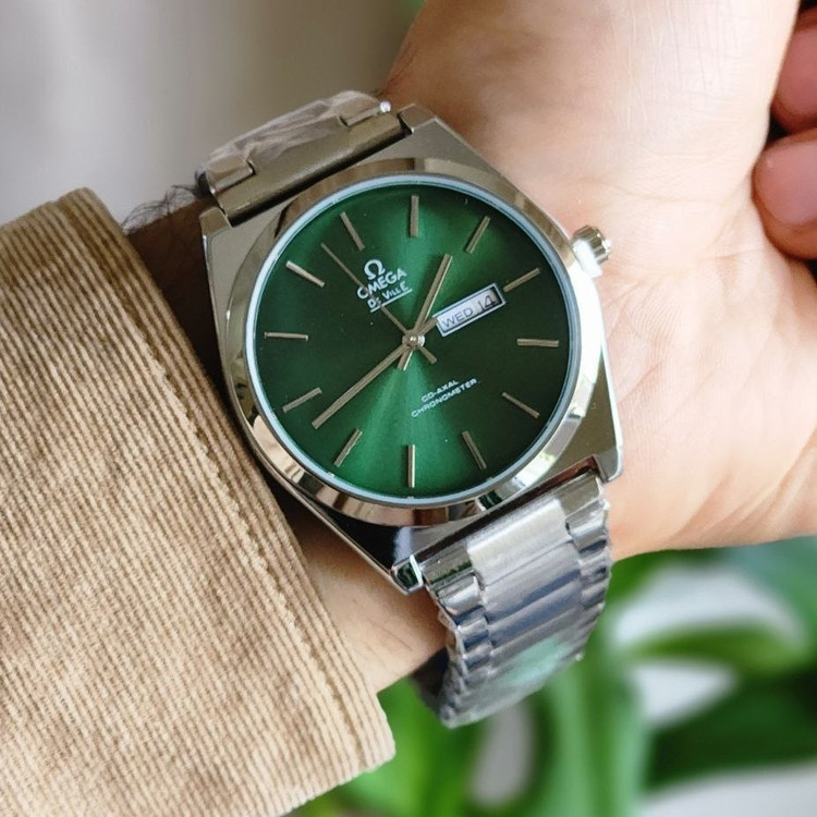 ساعت عقربه ای مردانه امگا omega بند استیل نقره ای صفحه سبز