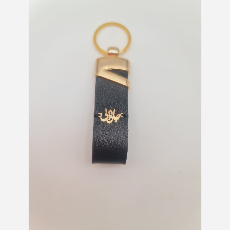 جاسوییچی چرم با پلاک طلا طرح جانی و دلی