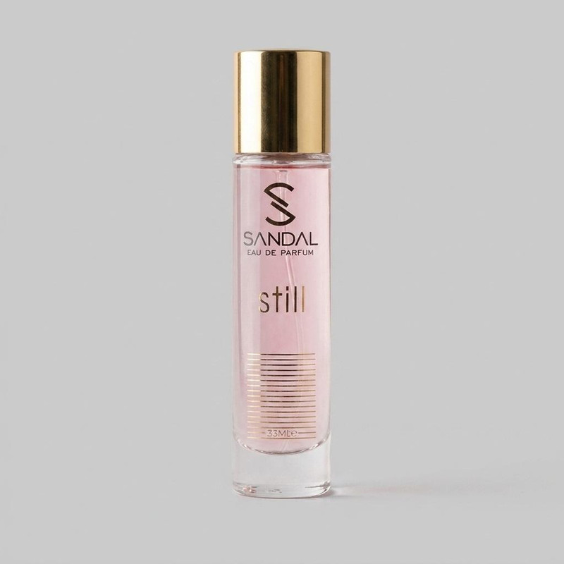 عطر جیبی زنانه صندل مدل still jennifer lopez با رایحه گلی و تند حجم 33 میلی‌لیتر