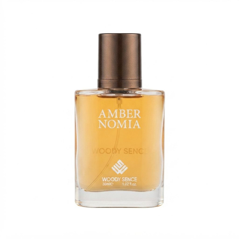 عطر جیبی وودی سنس مدل Amber Nomia با رایحه تلخ و چوبی حجم 30 میلیلیتر