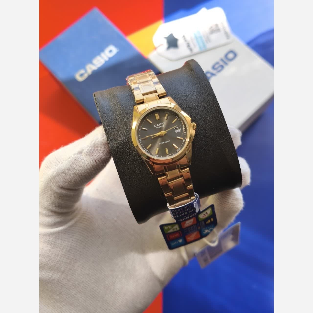 ساعت مچی زنانه کاسیو CASIO موتور ژاپنی بند طلایی صفحه مشکی + جعبه